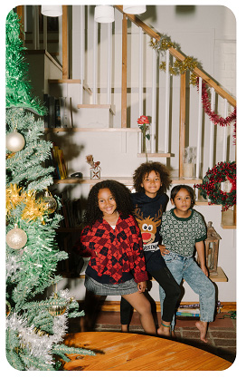 Family by Christmas tree